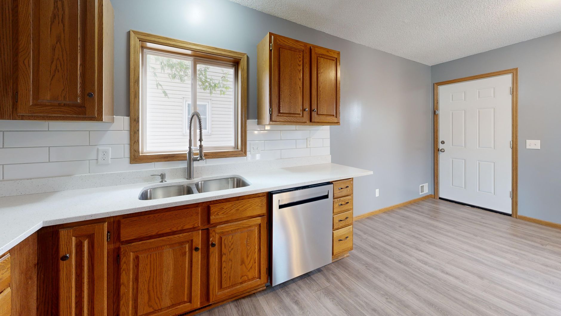 Spacious kitchen with oak cabinets, stainless steel appliances, and natural lighting in Bellevue, WA