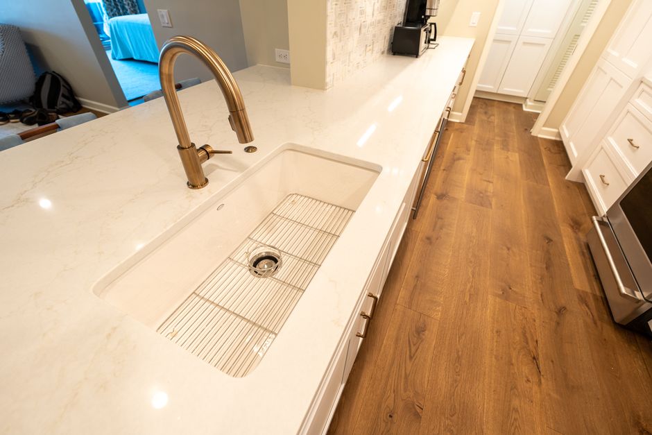 Kitchen with a marble countertop and modern fixtures.